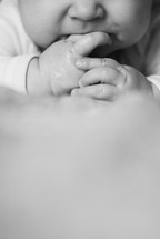 hands of an infant boy