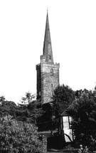 a stone tower and steeple on an English Church