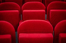 Plush red seats in a cinema autidtorium