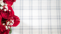 red roses and plaid background 