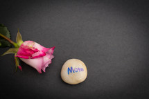 pink rose and stone with word mom