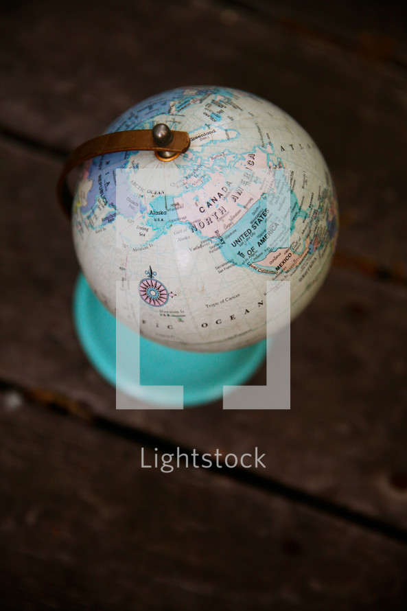 globe on old wood boards 