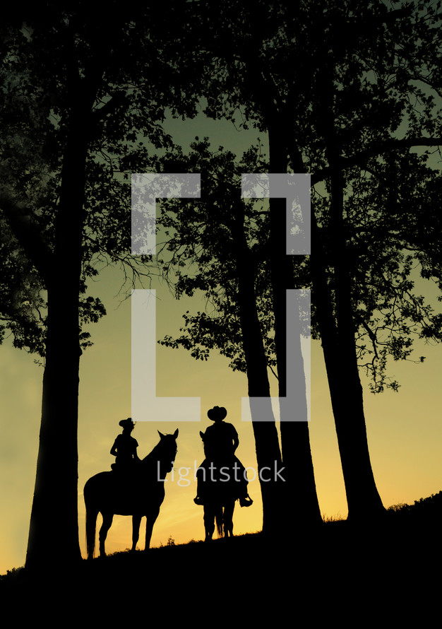 silhouette's of cowboys on horses 