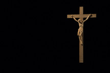 crucifix on a black wall 