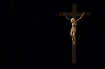 crucifix on a black wall 