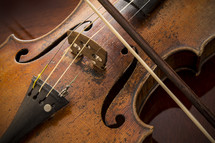 A vintage well used old violin and bow 