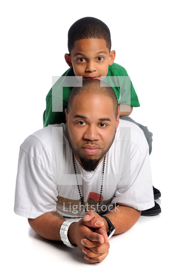 father and son posing for a portrait 