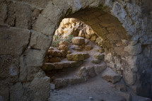 Stone archway under the ruins of Caesarea in Israel. Caesarea is a town in Israel located mid-way between Tel Aviv and Haifa, on the Israeli coastal plain near the city of Hadera. 