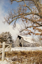 old barn and snow on the ground