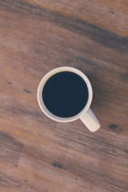 coffee mug on a wood floor 