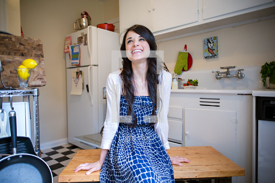 woman smiling in a kitchen 