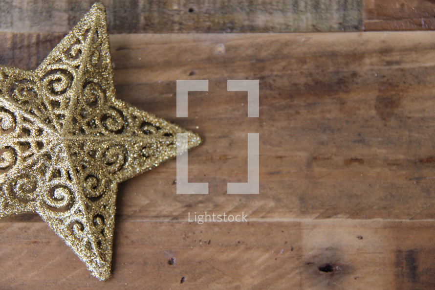gold star on a wood floor 