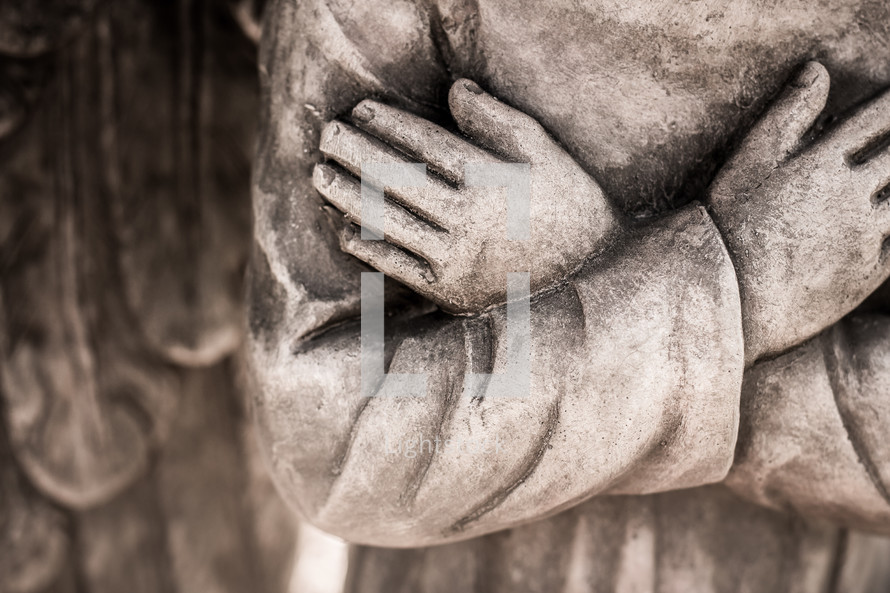 closeup of statue  - angel hands 