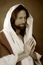 Shrouded Jesus with praying hands. 