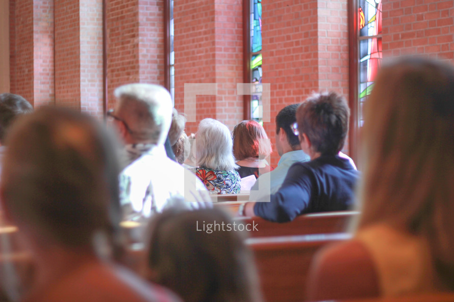 parishioners sitting in church pews at a Lutheran church 