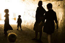 children playing in a tunnel 