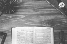 2 Corinthians, open Bible, Bible, pages, reading glasses, wood table 