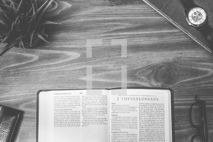 2 Thessalonians, open Bible, Bible, pages, reading glasses, wood table 
