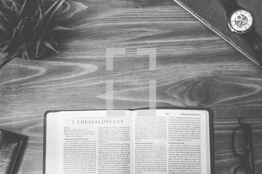 1 Thessalonians, open Bible, Bible, pages, reading glasses, wood table 