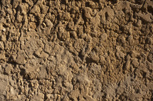 A crumbling clay brick wall on a very old building