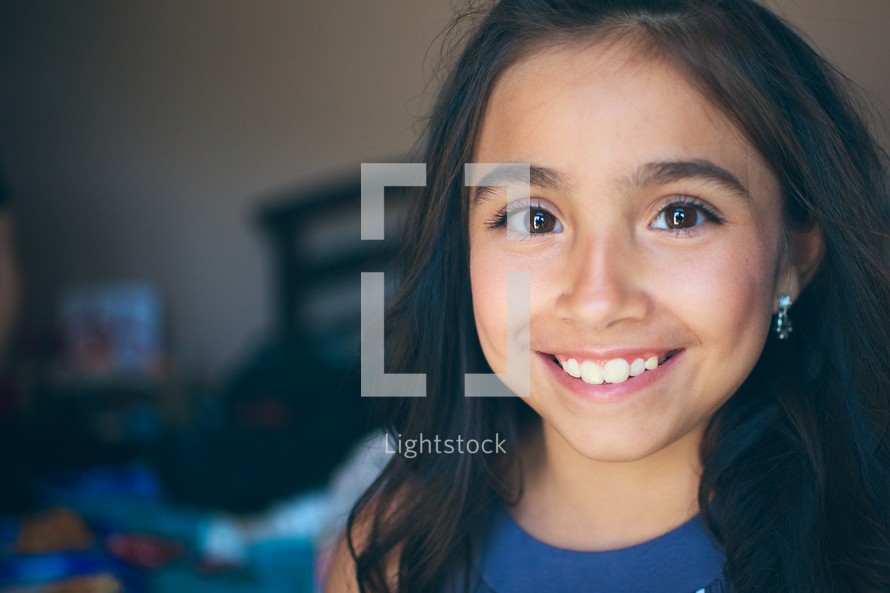 Face of a young girl smiling