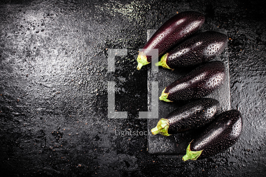 Fresh homemade eggplant on the table. On a wooden background. High quality photo