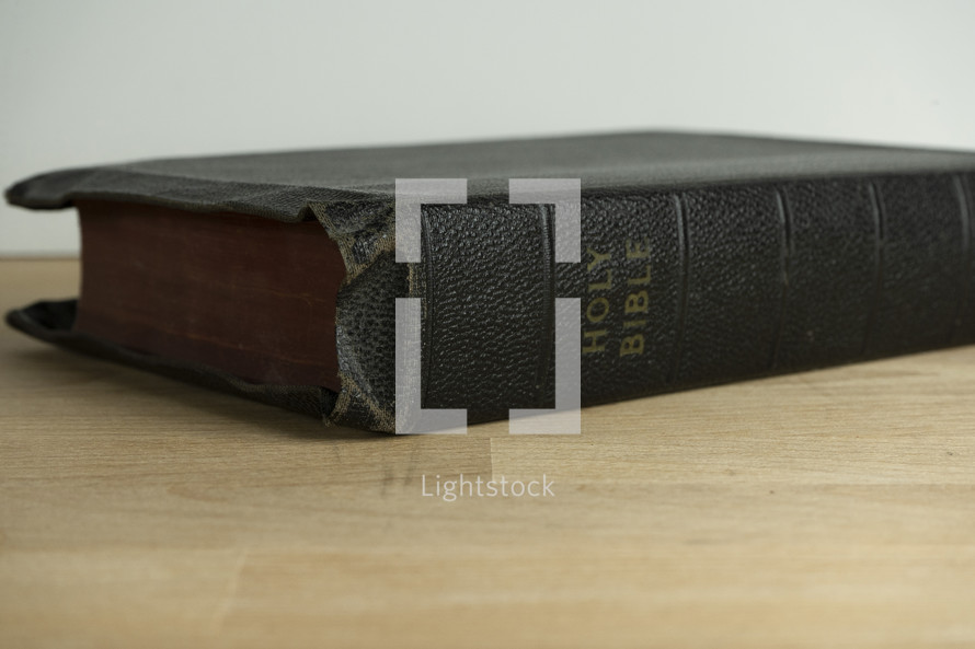 An old well worn Bible on a table