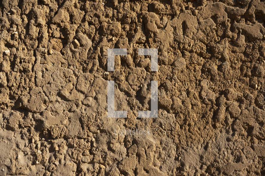 A crumbling clay brick wall on a very old building