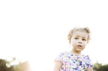 face of a toddler girl outdoors 