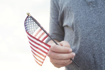Man holding an American flag.