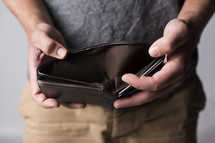 man holding an empty wallet 