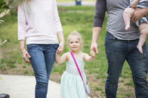 a family walking together in a park 