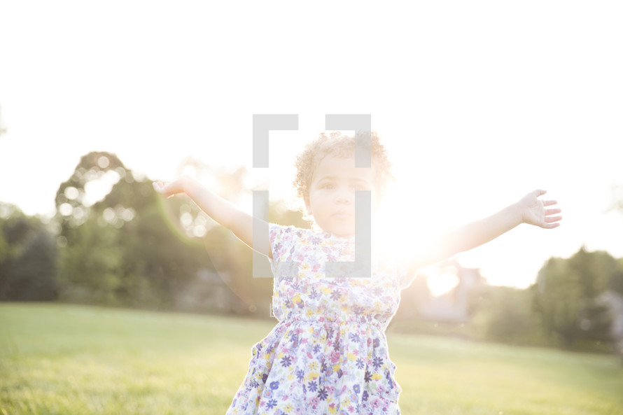 toddler girl with outstretched arms 