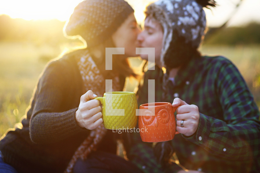 couple toasting with hot cocoa 