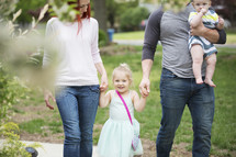 a family walking together in a park 