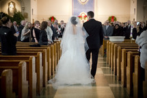 father walking his bride daughter down the aisle 