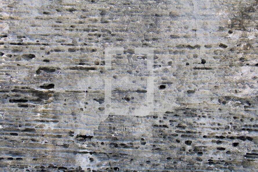 Eroded grey stone background 