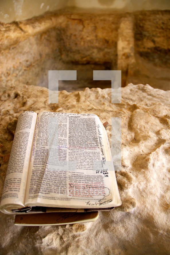 Bible opened next to the Empty Tomb
