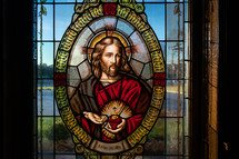 Stained glass window of Flaming Sacred Heart.