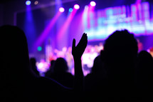 clapping hands at a concert 