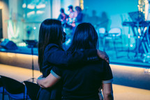 hugs at a worship service 