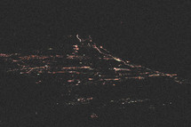 aerial view of city lights below 