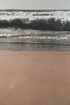 waves washing onto a beach 