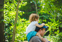 girl on father's shoulders 