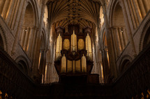 Church organ inside Norwich Cathedral, large pipe organ, beautiful religious architecture