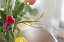 tulips in a vase on a table 