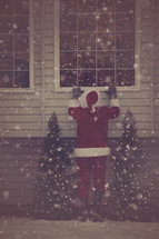 Santa peeking into a window 