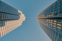looking up at tall city buildings 