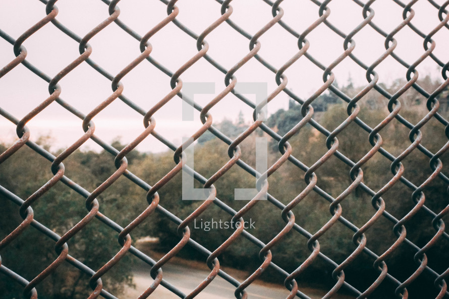 chain link fence and river river 