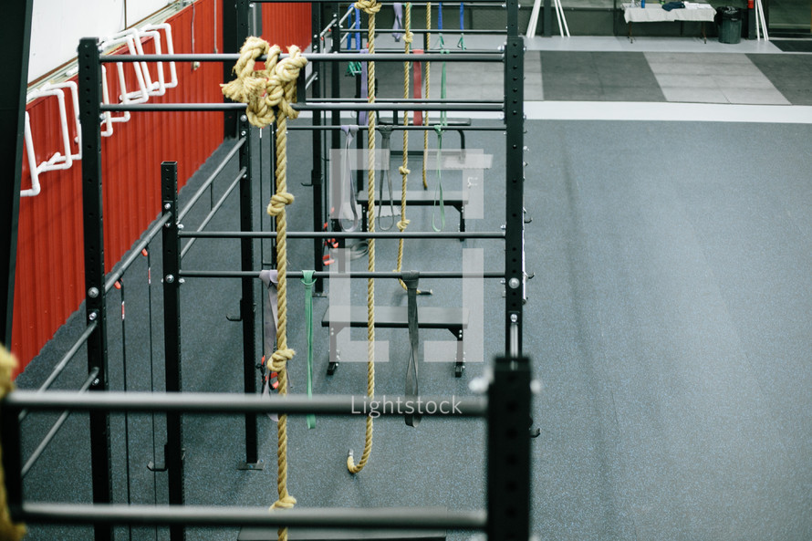 bars and ropes in a crossfit gym 
